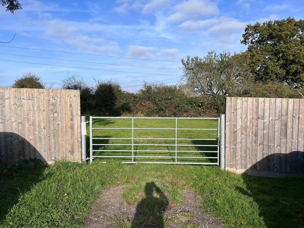 Lot: 16 - BUILDING PLOT WITH CONSENT FOR A THREE-BEDROOM BUNGALOW - View of site for development with gated access point